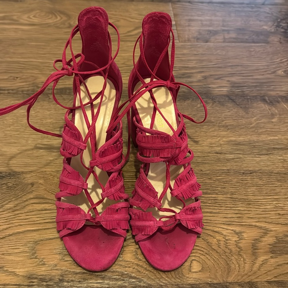 Pink Nine West lace up heels.